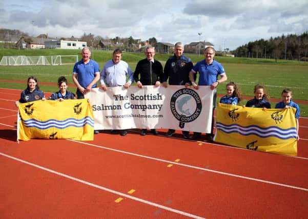 A selection of WIIGA athletes, team managers and committee members alongside Craig anderson, Chief Executive of main sponsor The Scottish Salmon Company as the final squad for this summers NatWest Island Games were revealed.