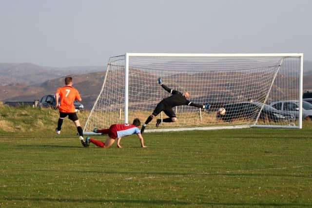 James Macleod saves for Lochs but his stop was turned in at the back post by the unmarked Macsween for 2-0.