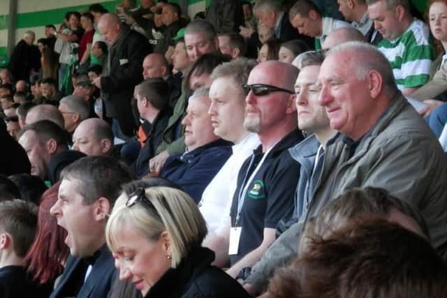 Island supporters enjoy the action from the Jock Stein stand