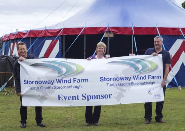 HebCelt director Caroline Maclennan with John Buswell (left), and Darren Cuming, project director for Lewis Wind Power.