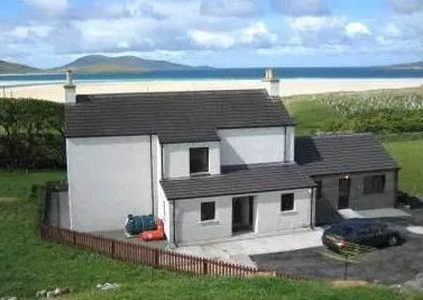 The cottage (on the right of the picture) is in an idyllic spot overlooking Luskentyre beach.