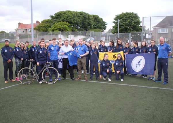 Alan Brown from The Scottish Salmon Company  was at the launch to handover the new kit  to athletes and managers of the Western Isles Island Games Association.