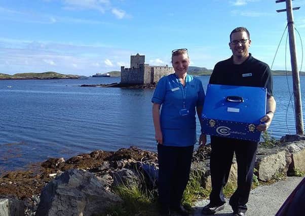 Veronica Gordon, Midwife, and Paul Daly, member of Western Isles Maternity Services Liaison Committee, pictured with the special cot.
