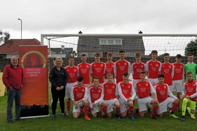 Point FC Under-18 team with Point and Shandwick Trust general manager Donald John MacSween