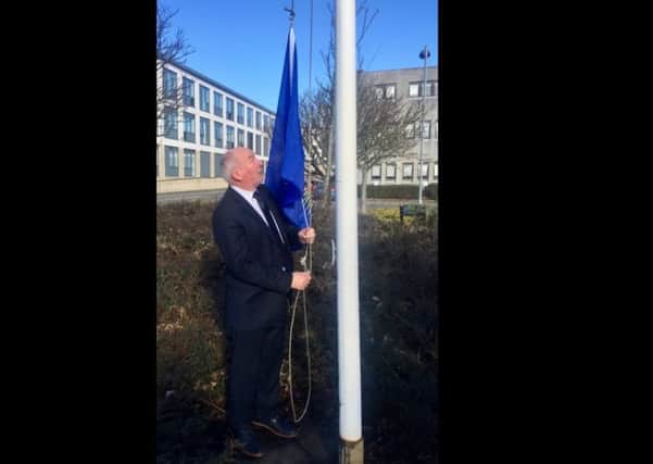 Councillor Alasdair Macleod, Vice Chairman of the Policy and Resources Committee, raised the flag.