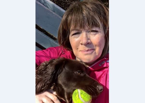 Island pet owner June Lafferty, with her dog Coco, criticised Loganair's price hike.