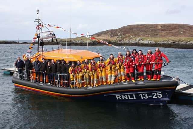 The crew onboard the new lifeboat at Leverburgh pier.