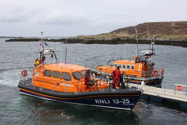 The new Shannon class lifeboat with the Mersey class lifeboat at Leverburgh pier.
