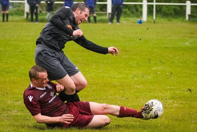 The final was a fesity affair with no quarter held by either side. Here Lewis Mackenzie wins the ball from Dan Macphail. (pic by Iain Macdonald)