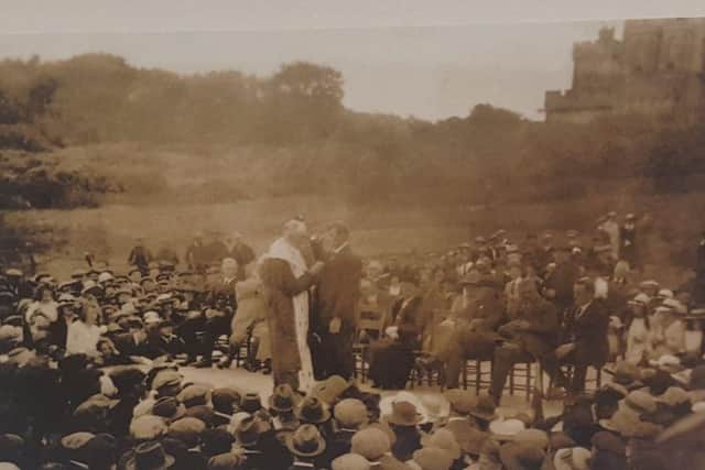 John Finlay Macleod of Ness whose bravery in carrying a heaving line ashore saved dozens of lives. This picture shows him receiving an award for his bravery from the Provost of Stornoway, with Lord and Lady Leverhulme present, at an event on Lews Castle Green.