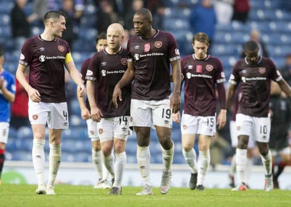 John Souttar, left, and the Hearts players dejection was clear to see after their unbeaten start to the season ended at Ibrox
