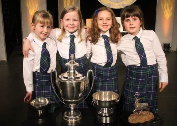 Sir E Scott's under 13 choir enjoyed a stunning Tuesday at the Mod. Here are some of the youngest choir members with the coveted silverware won on the day.