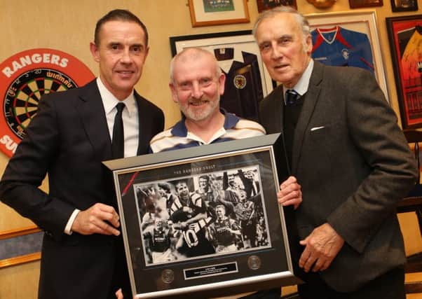 Rangers legends David Weir and Ronnie Mackinnon with a lucky fan, who secured some of the Rangers' memorabilia which was up for raffle.