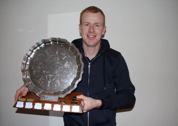 Lochs' John 'Uig' Morrison with the Player of the Year trophy.