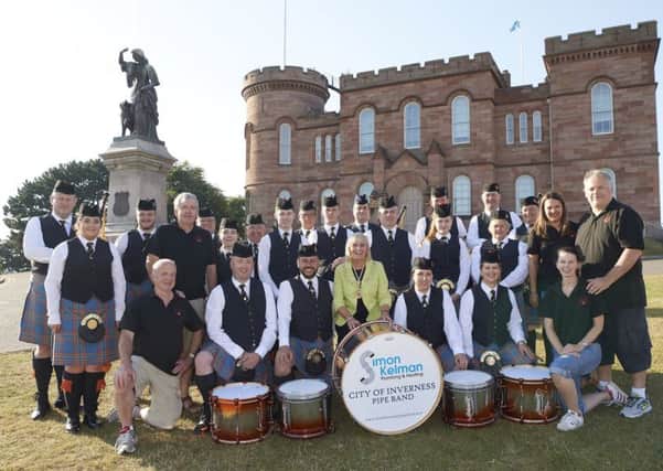 City of inverness Pipe Band with LCC staff and Provost Helen Carmichael.