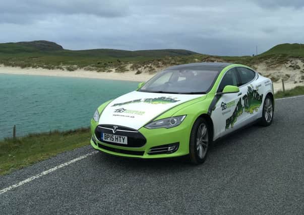 The TIG Tesla electric car pictured in Vatersay. The car is helping to highlight a campaign to provide climate change and energy saving advice to people across the Islands and those attending HebCelt 2019.