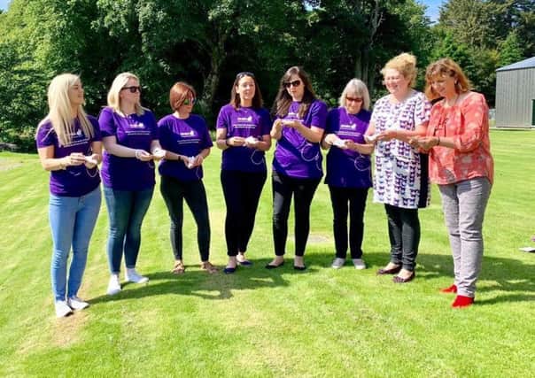 Pictured are Susan Simpson, Joanne Murray-Stewart and Members of the SiMBA Support Group Releasing butterflies for the families who could not attend.