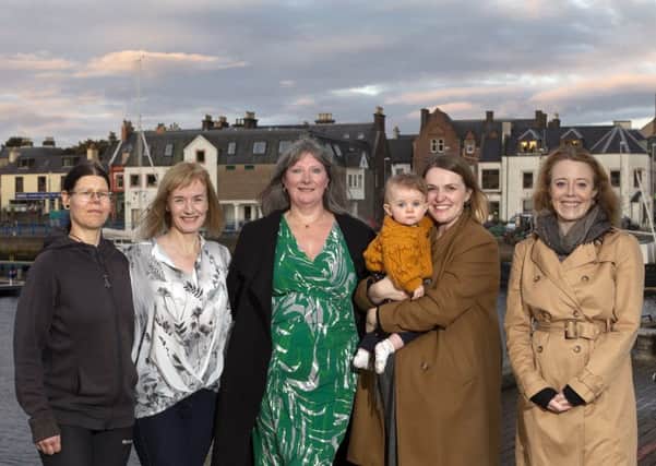 Stornoway's five-strong Community Council are Susanne Erbida, Melinda Gillen, Joan Muir, Jane Hepburn MacMillan (supported by her gorgeous daughter Florence) and Katie Laing.  Photo by Sandie Maciver of SandiePhotos