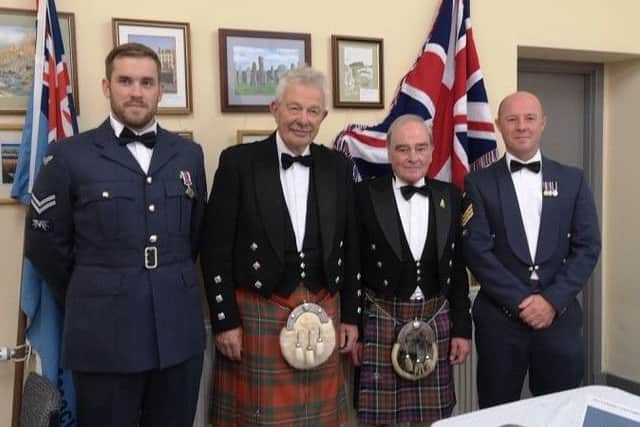 RAFA Area President, Air Vice Marshal David Niven, with RAFA Stornoway Chairman John Macdonald and RAF servicemen from Benbecula.