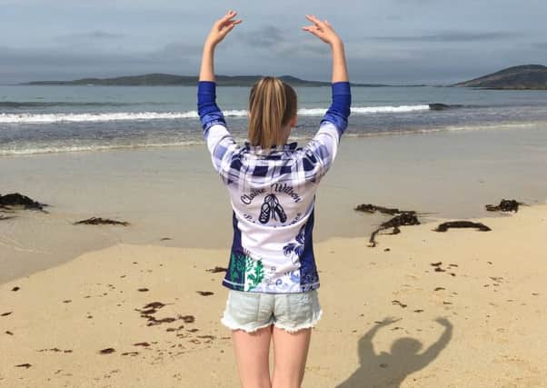 Emma practising her moves on a Harris beach.