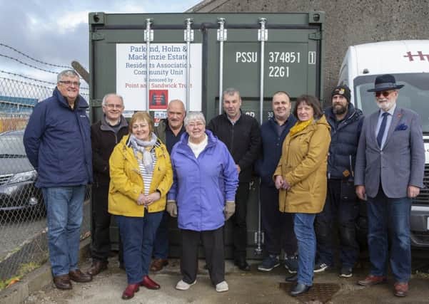 Representatives of Point and Sandwick Trust and the Parkend, Holm and Mackenzie Estate Residents Association with the new container. Picture by Sandie Maciver of SandiePhotos.