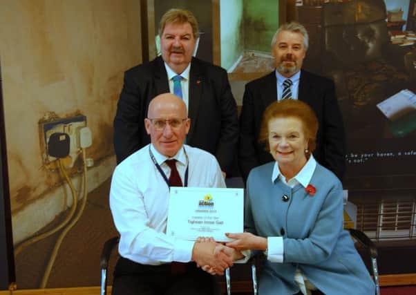 Pictured top at the awards ceremony are: Norman Kerr, OBE Director of Energy Action Scotland and  Stewart Wilson, TIG CEO.   Pictured bottom  are: Donald Mackinnon, TIG Depute CEO and  Baroness Helen Liddell.