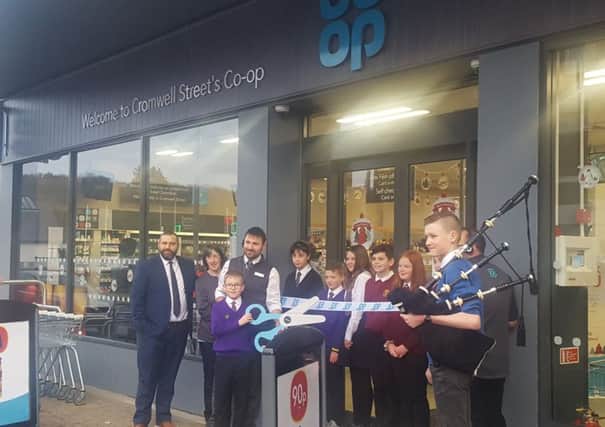 Cutting the ribbon at the new Co-op store on Stornoway's high street.