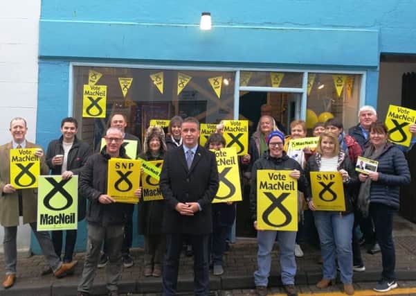 SNP candidate Angus Brendan MacNeil with his supporters outside of the campaign base in Stornoway.