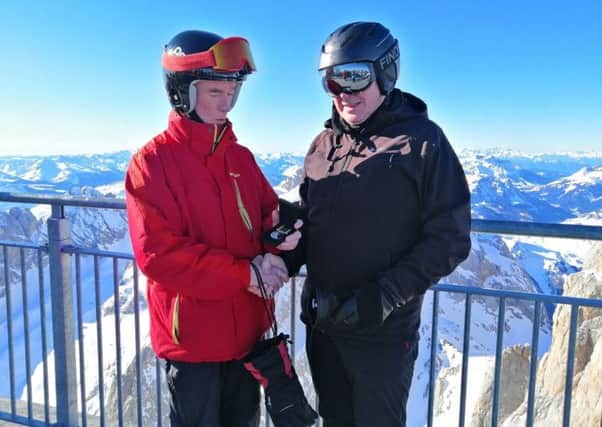 Captain Tim Martin (right) receiving the Cadet Force Medal during his skiing trip to Italy by the Battalions Commandant Col Cassidy.